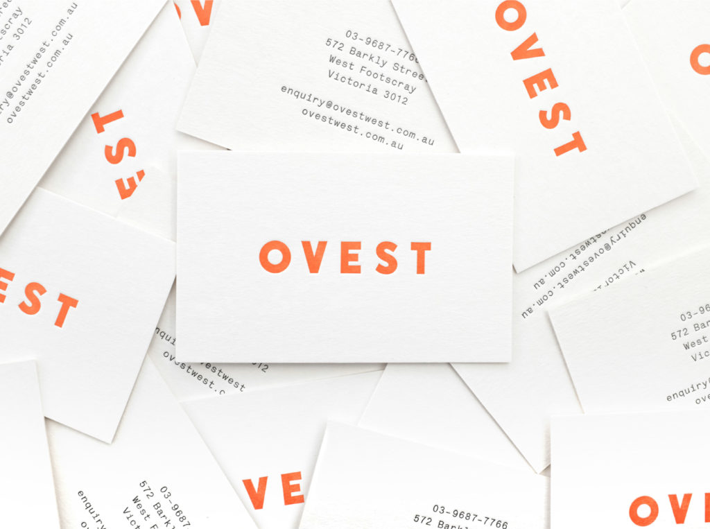 business cards in living coral and navy